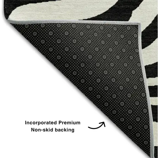 8' Black And Ivory Animal Print Washable Round Rug With UV Protection Photo 4