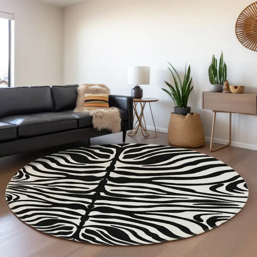 8' Black And Ivory Animal Print Washable Round Rug With UV Protection Photo 3