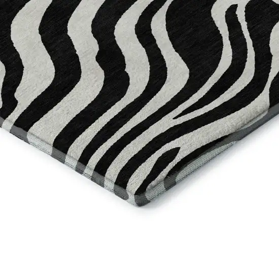 8' Black And Ivory Animal Print Washable Round Rug With UV Protection Photo 5