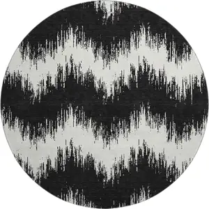 Photo of 8' Black And Ivory Chevron Washable Round Rug With UV Protection