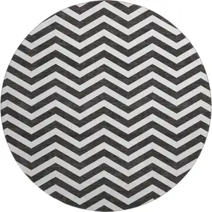 Photo of 8' Black And Ivory Chevron Washable Round Rug With UV Protection