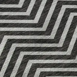 Photo of 8' Black And Ivory Chevron Washable Round Rug With UV Protection