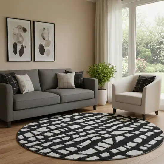 8' Black And Ivory Cobblestone Washable Round Rug With UV Protection Photo 1