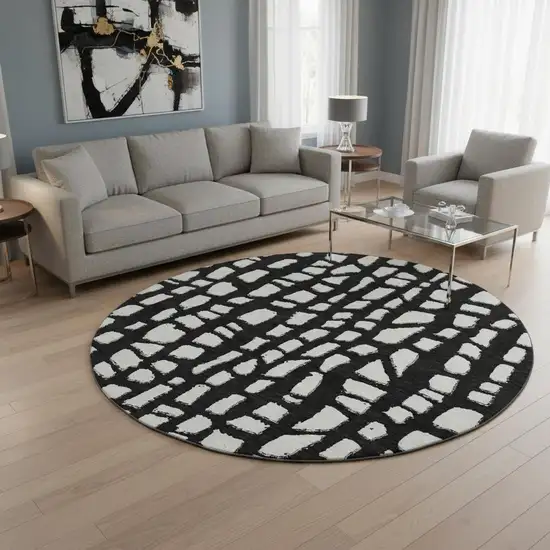 8' Black And Ivory Cobblestone Washable Round Rug With UV Protection Photo 2