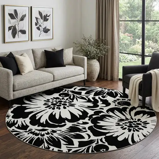 8' Black And Ivory Floral Washable Round Rug With UV Protection Photo 1