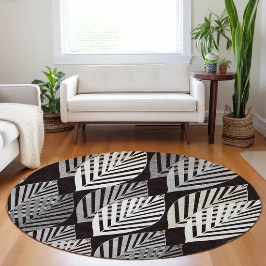 8' Black And Ivory Floral Washable Round Rug With UV Protection Photo 5