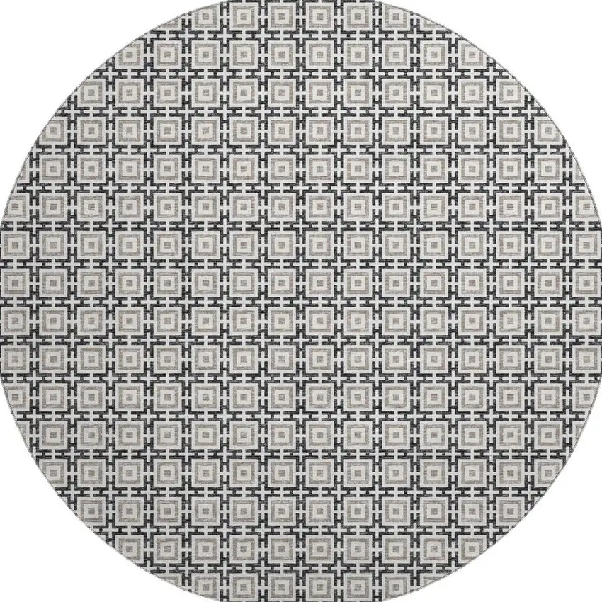 8' Black And Ivory Geometric Washable Round Rug With UV Protection Photo 4