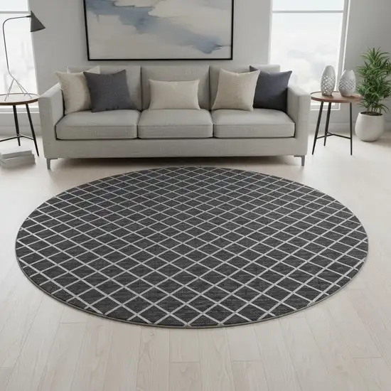 8' Black And Ivory Geometric Washable Round Rug With UV Protection Photo 1