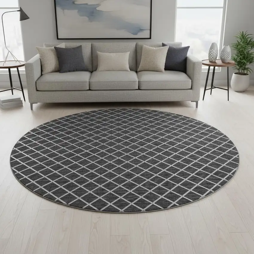 8' Black And Ivory Geometric Washable Round Rug With UV Protection Photo 1
