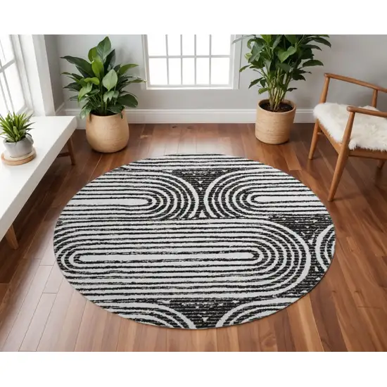 8' Black And Ivory Geometric Washable Round Rug With UV Protection Photo 2