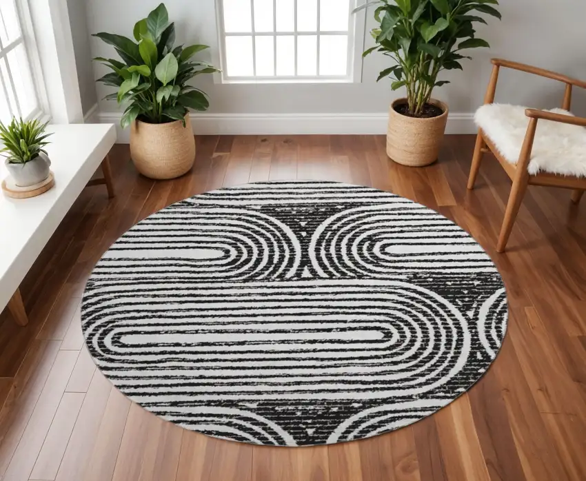 8' Black And Ivory Geometric Washable Round Rug With UV Protection Photo 2