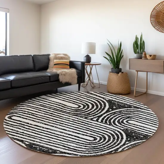 8' Black And Ivory Geometric Washable Round Rug With UV Protection Photo 5