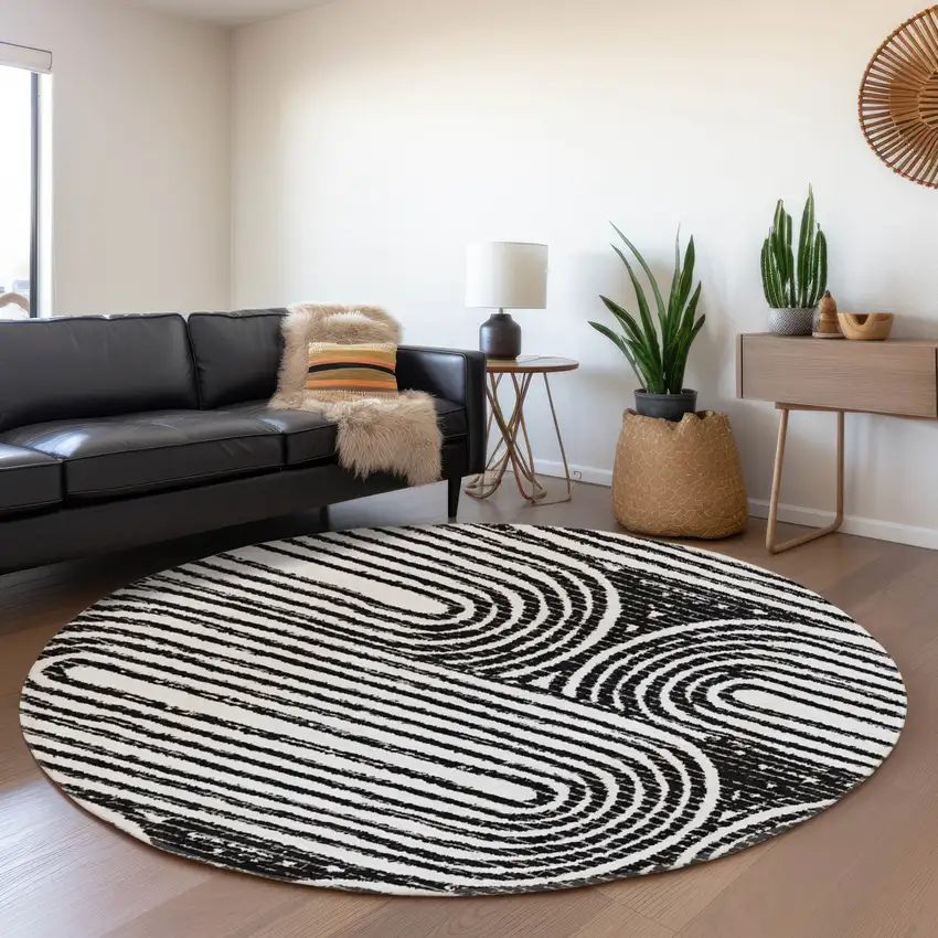 8' Black And Ivory Geometric Washable Round Rug With UV Protection Photo 5