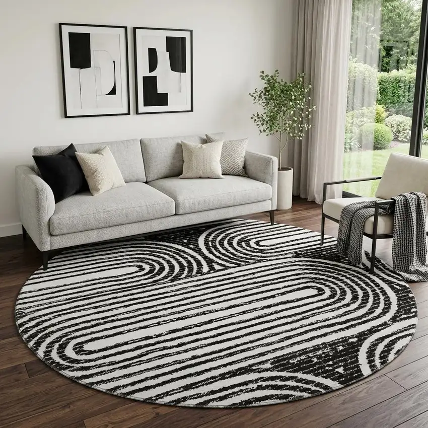 8' Black And Ivory Geometric Distressed Washable Round Rug With UV Protection Photo 1