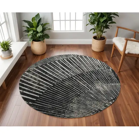8' Black And Ivory Geometric Washable Round Rug With UV Protection Photo 2