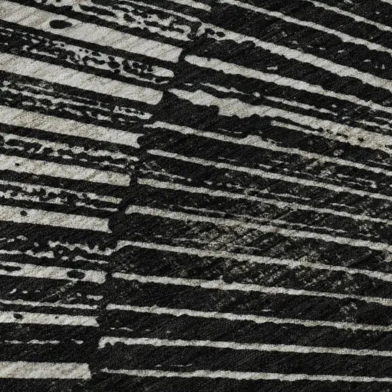 8' Black And Ivory Geometric Washable Round Rug With UV Protection Photo 9