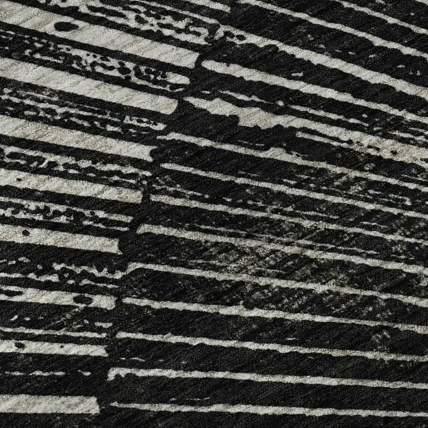 8' Black And Ivory Geometric Washable Round Rug With UV Protection Photo 9