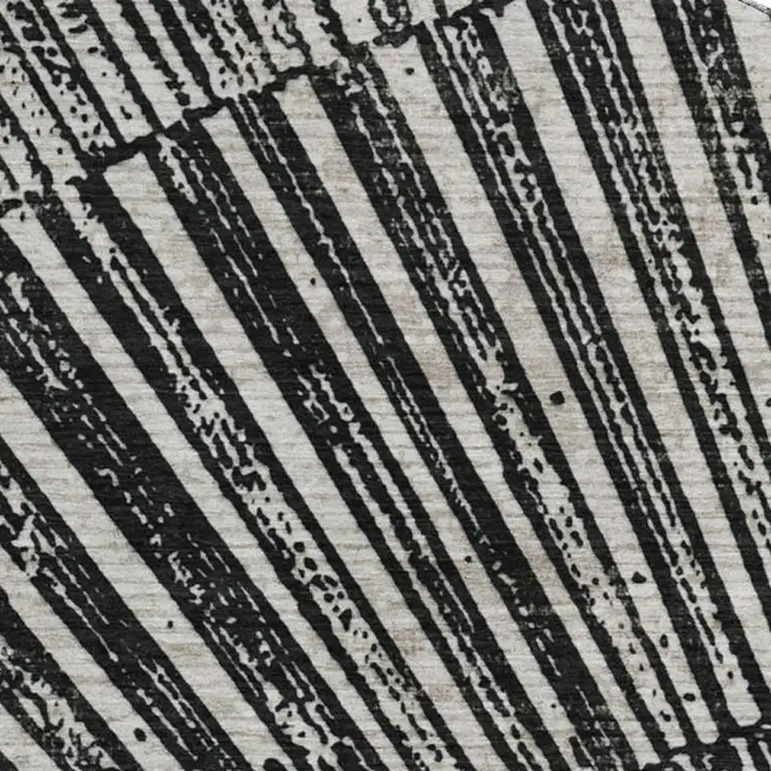 8' Black And Ivory Geometric Washable Round Rug With UV Protection Photo 3