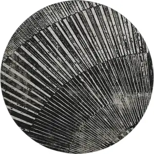 Photo of 8' Black And Ivory Geometric Washable Round Rug With UV Protection