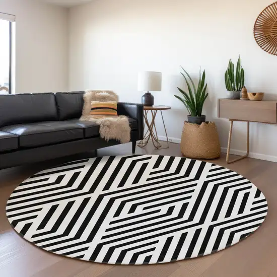8' Black And Ivory Geometric Washable Round Rug With UV Protection Photo 5