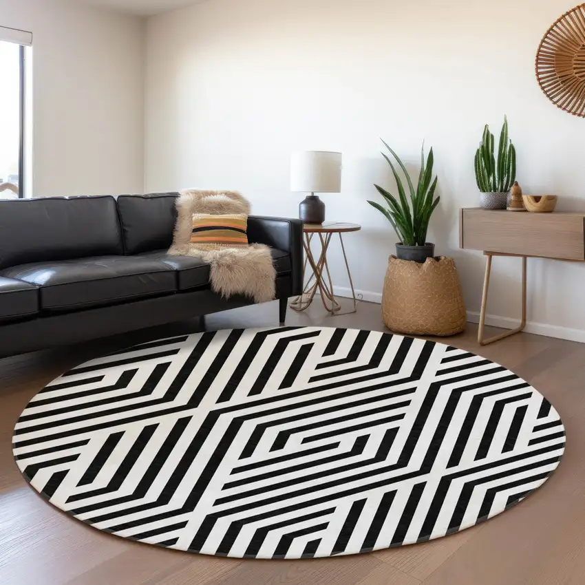 8' Black And Ivory Geometric Washable Round Rug With UV Protection Photo 5