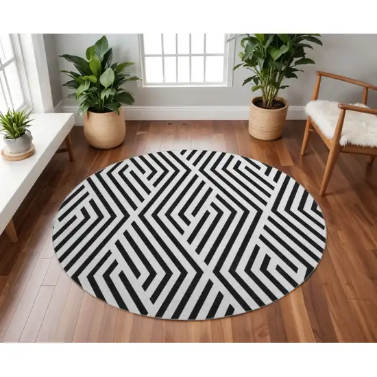 8' Black And Ivory Geometric Washable Round Rug With UV Protection Photo 2