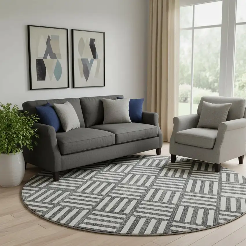 8' Black And Ivory Geometric Washable Round Rug With UV Protection Photo 1