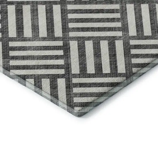 8' Black And Ivory Geometric Washable Round Rug With UV Protection Photo 6