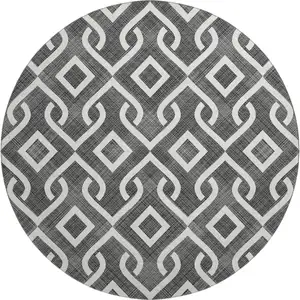 Photo of 8' Black And Ivory Geometric Washable Round Rug With UV Protection