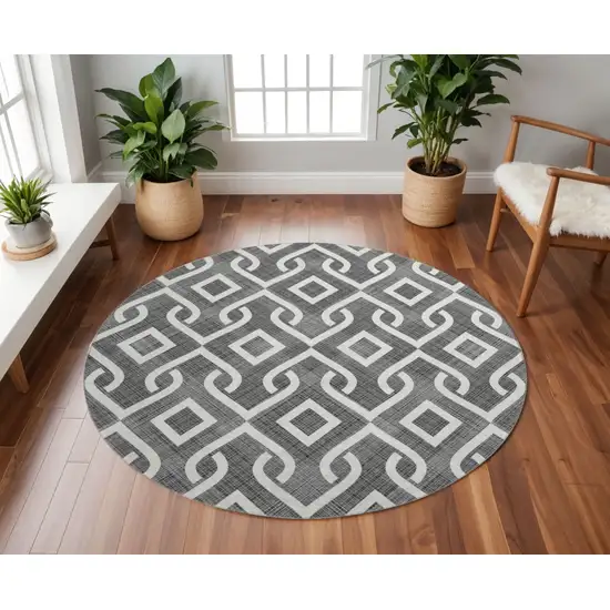 8' Black And Ivory Geometric Washable Round Rug With UV Protection Photo 2