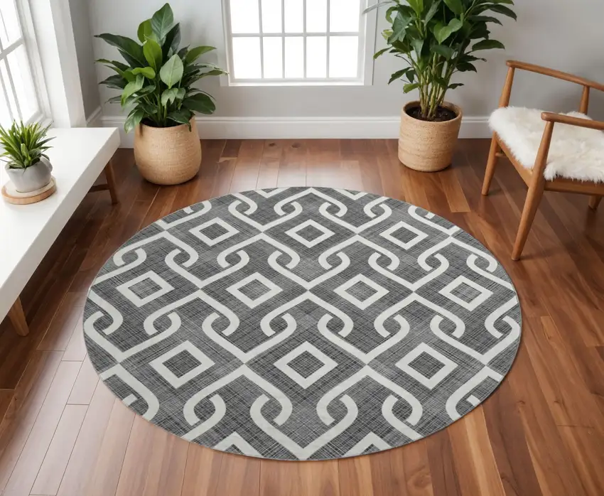 8' Black And Ivory Geometric Washable Round Rug With UV Protection Photo 2
