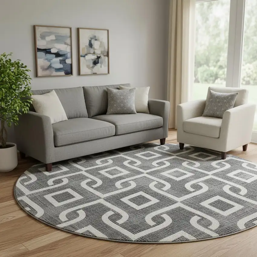 8' Black And Ivory Geometric Washable Round Rug With UV Protection Photo 1