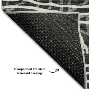 Photo of 8' Black And Ivory Geometric Washable Round Rug With UV Protection