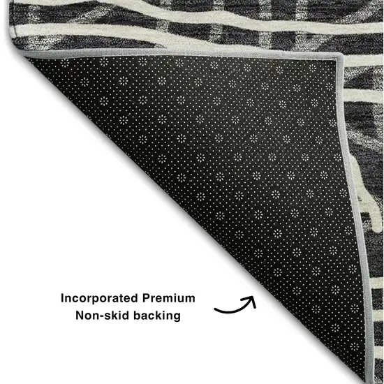 8' Black And Ivory Geometric Washable Round Rug With UV Protection Photo 6