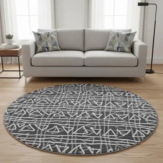 8' Black And Ivory Geometric Washable Round Rug With UV Protection Photo 2