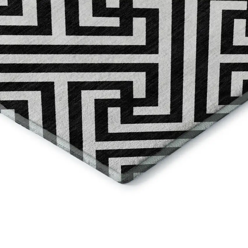 8' Black And Ivory Geometric Washable Round Rug With UV Protection Photo 7