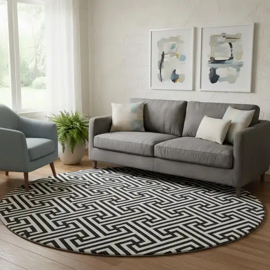 8' Black And Ivory Geometric Washable Round Rug With UV Protection Photo 1