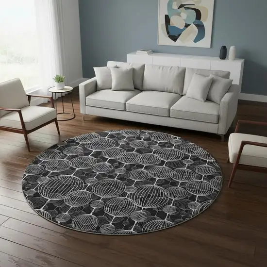 8' Black And Ivory Geometric Washable Round Rug With UV Protection Photo 2