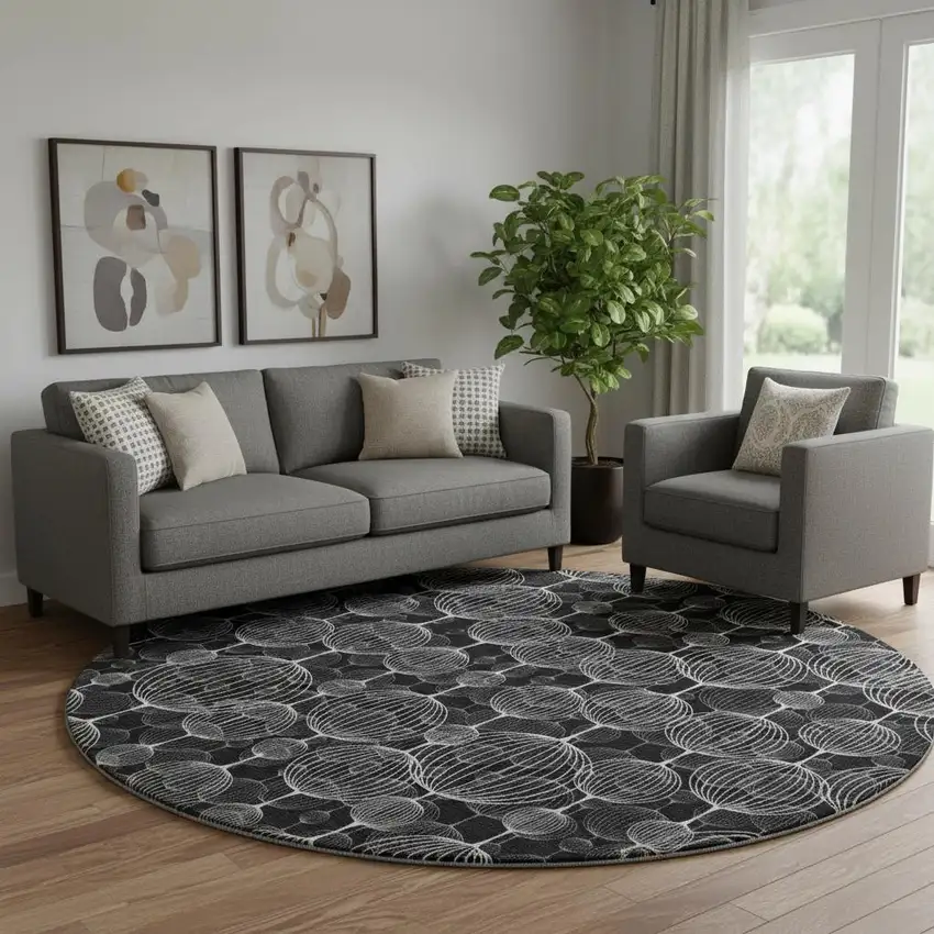 8' Black And Ivory Geometric Washable Round Rug With UV Protection Photo 1