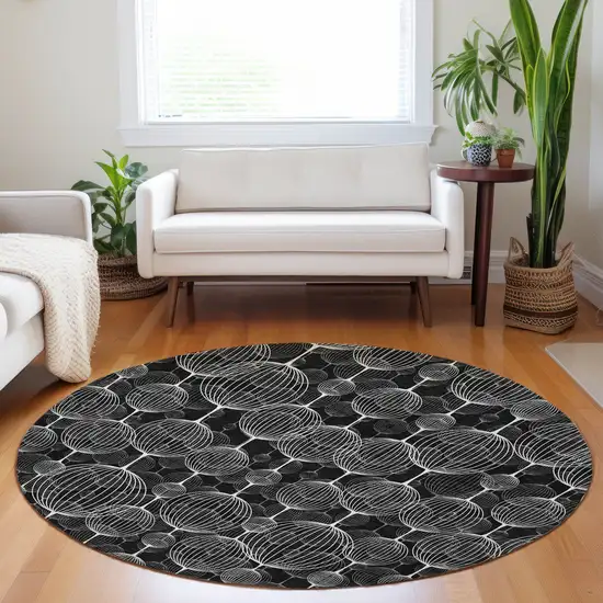 8' Black And Ivory Geometric Washable Round Rug With UV Protection Photo 5
