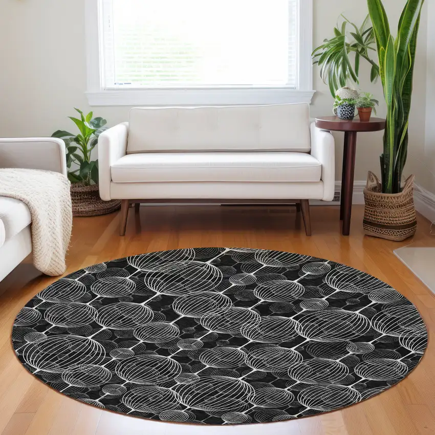 8' Black And Ivory Geometric Washable Round Rug With UV Protection Photo 5