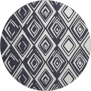 Photo of 8' Black And Ivory Geometric Washable Round Rug With UV Protection