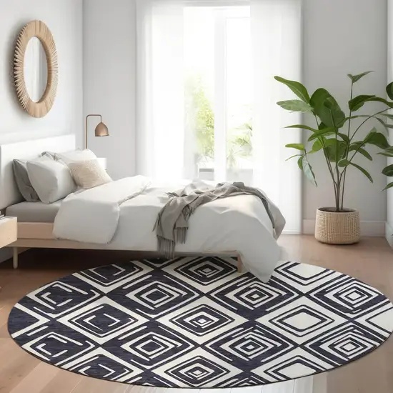 8' Black And Ivory Geometric Washable Round Rug With UV Protection Photo 5