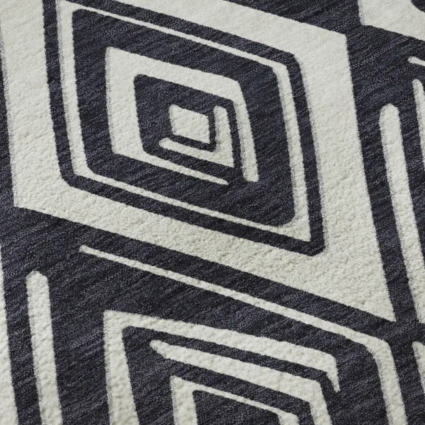 8' Black And Ivory Geometric Washable Round Rug With UV Protection Photo 9