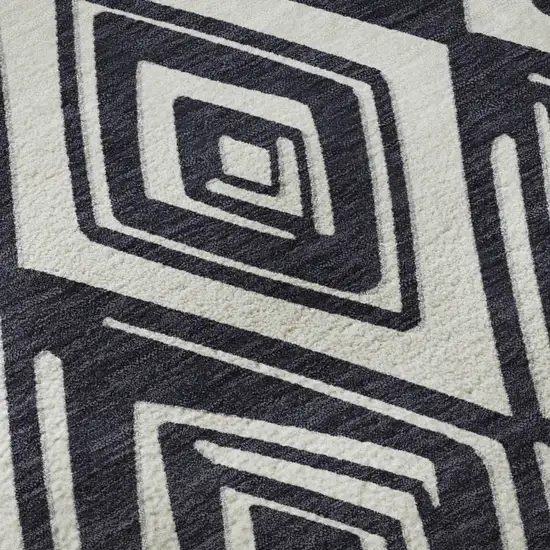 8' Black And Ivory Geometric Washable Round Rug With UV Protection Photo 9