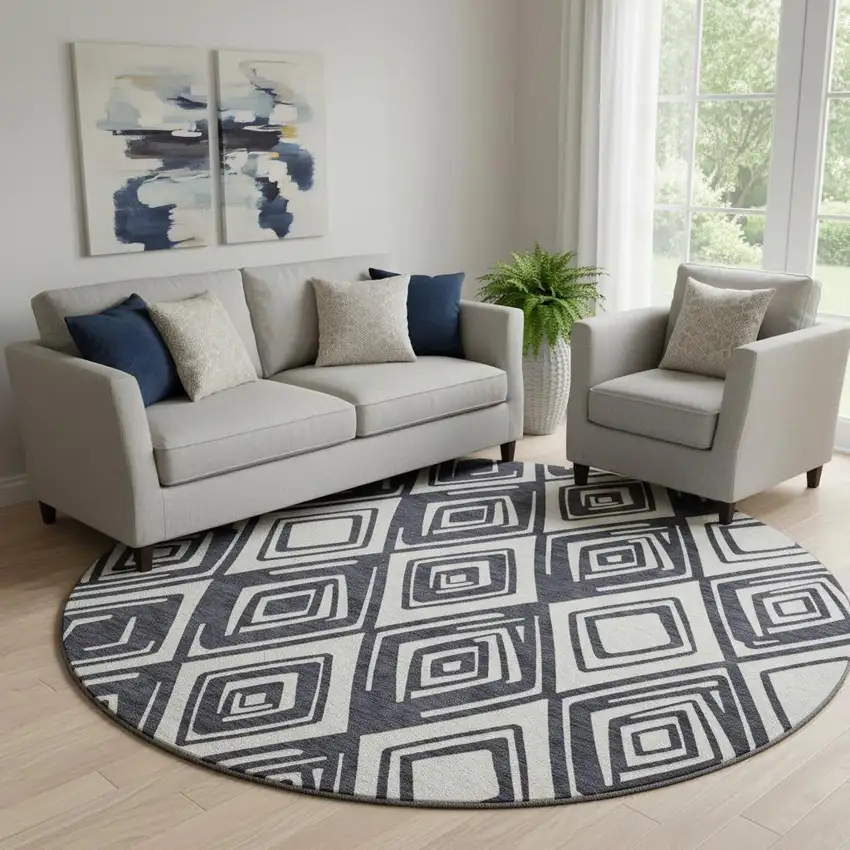 8' Black And Ivory Geometric Washable Round Rug With UV Protection Photo 1