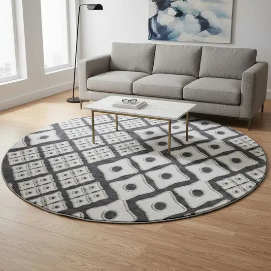 8' Black And Ivory Geometric Washable Round Rug With UV Protection Photo 1