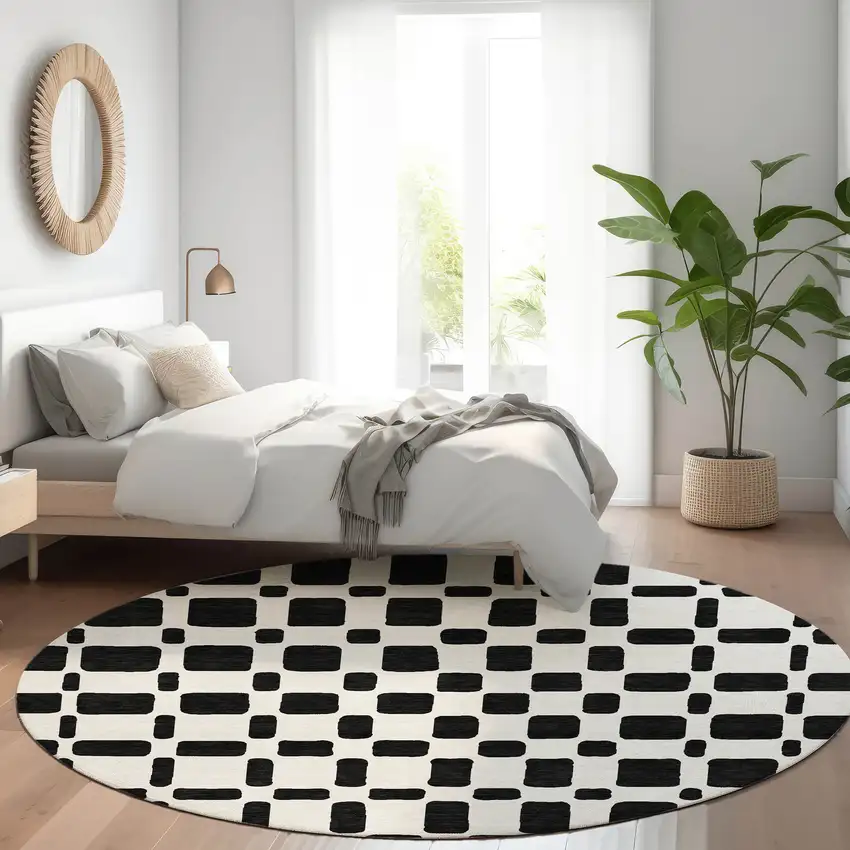 8' Black And Ivory Geometric Washable Round Rug With UV Protection Photo 5