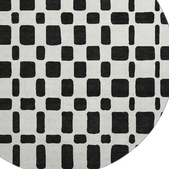 8' Black And Ivory Geometric Washable Round Rug With UV Protection Photo 3