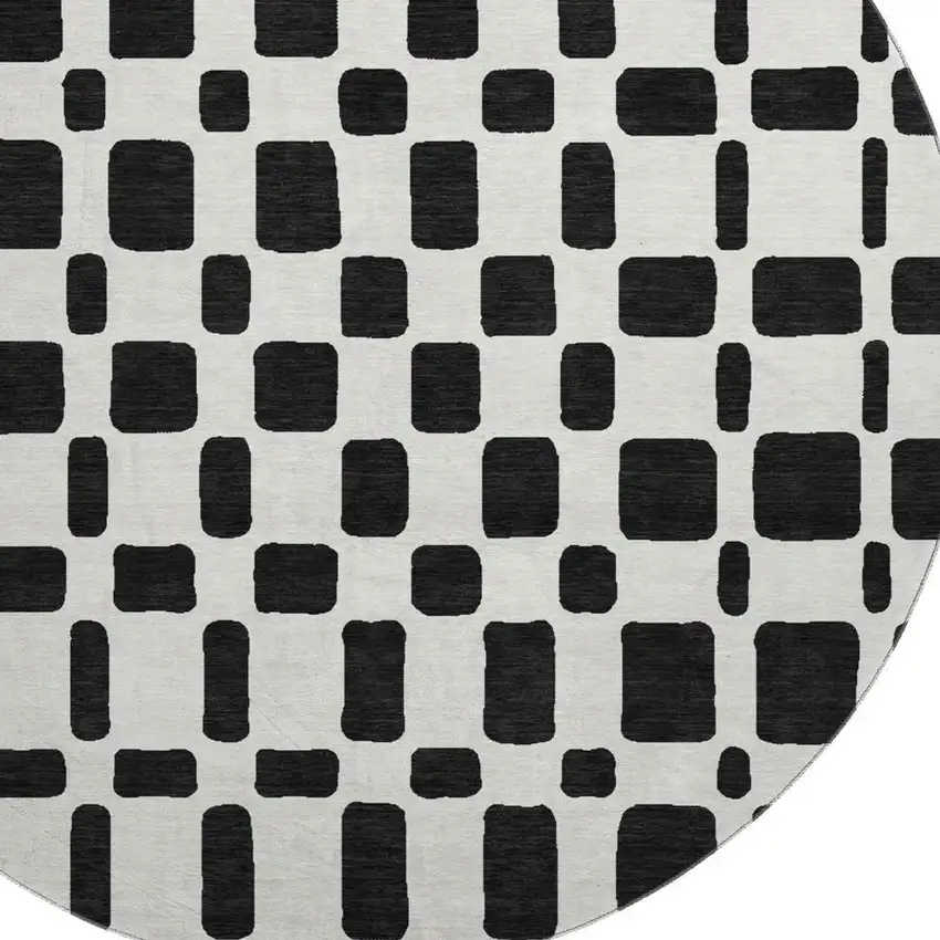 8' Black And Ivory Geometric Washable Round Rug With UV Protection Photo 3